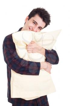 Royalty Free Photo of a Man in Pajamas Holding a Pillow