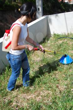 Royalty Free Photo of a Woman Fertilizing Soil