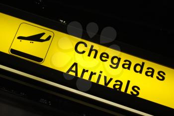 Royalty Free Photo of a Yellow Arrival Sign