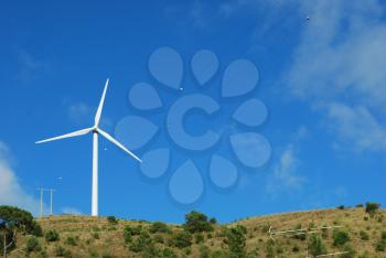 Royalty Free Photo of a Wind Turbine on a Mountain