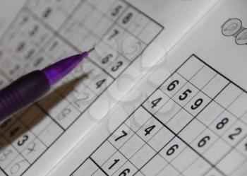 Royalty Free Photo of a Pencil on a Sudoku Grid