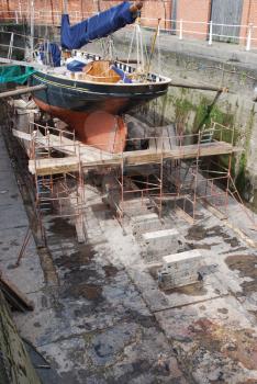 Royalty Free Photo of Antique Boat Reparation at Dry Docks
