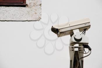 Royalty Free Photo of a Video Surveillance Camera on a Wall

