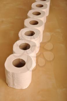 Royalty Free Photo of a Row of Toiler Paper Rolls
