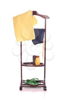 Royalty Free Photo of Beach Clothing on a Wooden Hanger