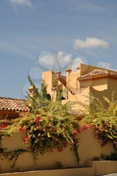 Royalty Free Photo of a House With Bougainvillea Flowers in Marbella, Spain