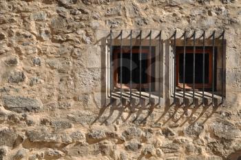Royalty Free Photo of a Medieval Building With Bars