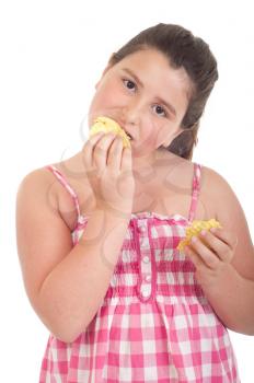 Royalty Free Photo of a Little Girl Eating Chips