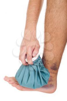 Royalty Free Photo of a Man Icing a Sprained Ankle