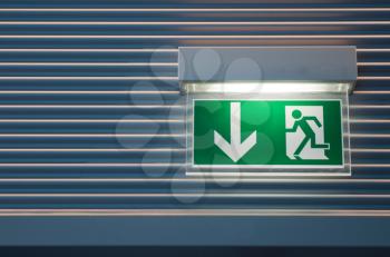 Royalty Free Photo of an Illuminated Green Emergency Exit Sign 