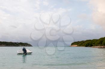 Royalty Free Photo of a Motor Boat at a Tropical Beach in Willikies, Antigua 