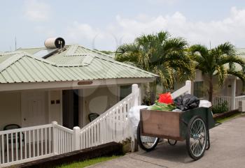 Royalty Free Photo of a Cleaning Cart Outside a Villa