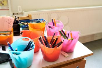 colorful school art supplies in a classroom