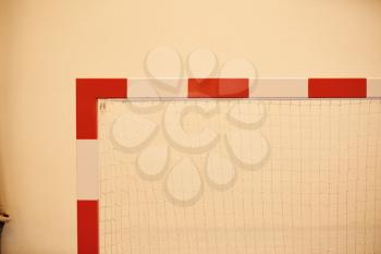 Red and white soccer goal at a school