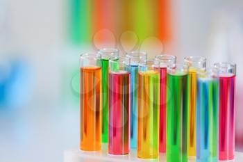 Test tubes with colorful samples in laboratory, closeup�