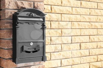 Mail box on fence outdoors�