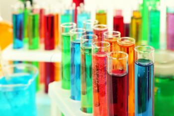 Many test tubes with colorful liquids, closeup�