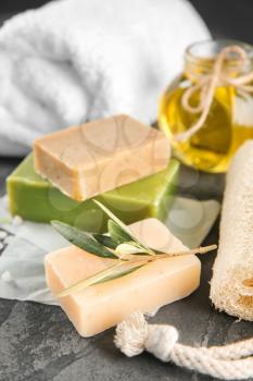Bars of natural soap with olive extract on table�