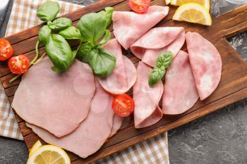 Composition with delicious sliced ham on textured table�