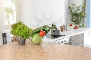Fresh vegetables on wooden table in kitchen�