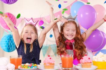 Cute little girls celebrating birthday at home�