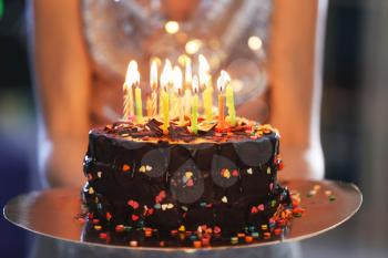Young woman with birthday cake, closeup�
