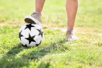 Man with with soccer ball outdoors�