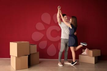 Happy young couple after moving to their new house�