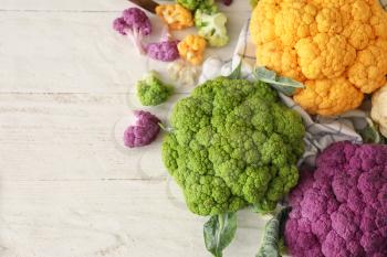 Different cauliflower cabbage on white wooden table�