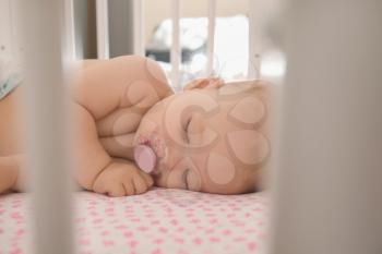 Cute little baby sleeping in crib�