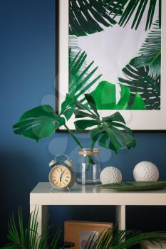 Tropical leaves in modern stylish interior�