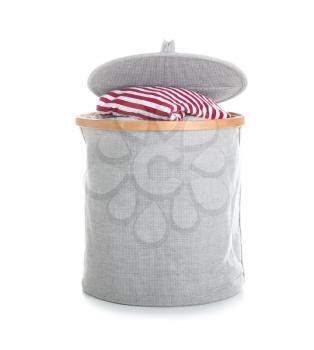 Laundry basket with dirty clothes on white background�