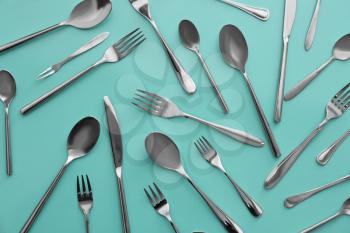 Set of cutlery on color background, flat lay�