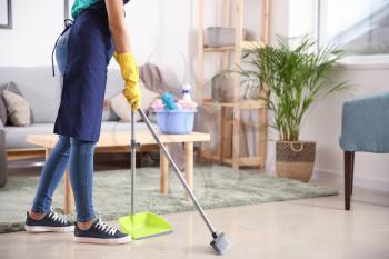 Female janitor cleaning flat�