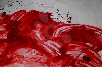 Pool of blood on tiled floor�
