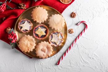 Plate with tasty mince pies on table�