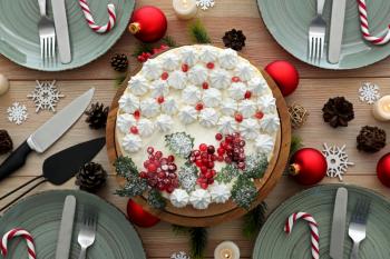 Tasty Christmas cake on festive table�