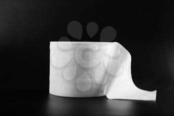 Roll of toilet paper on dark background�
