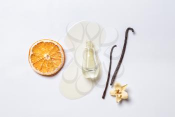 Composition with vanilla essence on white background�