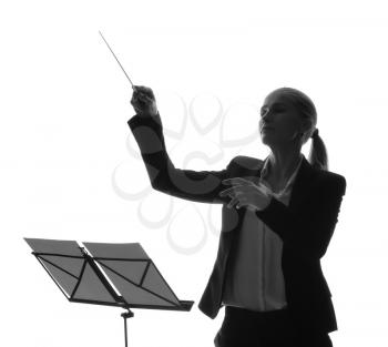 Silhouette of female orchestral conductor on white background�