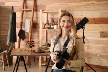 Portrait of female food photographer in home studio�