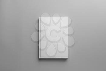 Book with blank cover on light background�
