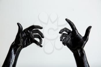 Painted hands on light background�