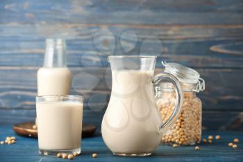 Tasty soy milk on wooden table�