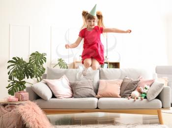 Jumping little girl at Birthday party�