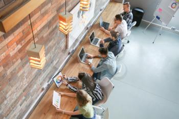 Young people having business meeting in modern office�