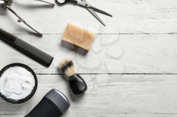 Set of male shaving accessories on white wooden background�