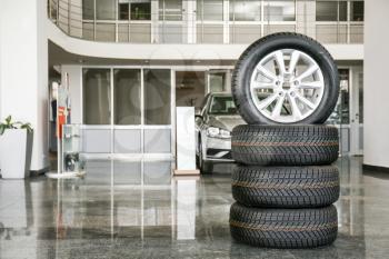 Tires in modern car showroom�