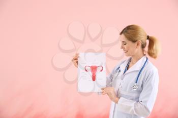 Portrait of beautiful gynecologist on color background�