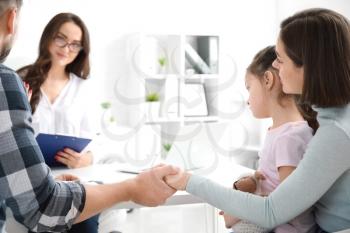 Family visiting psychologist in office�